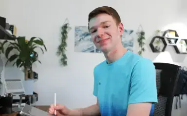 High school student taking notes at home