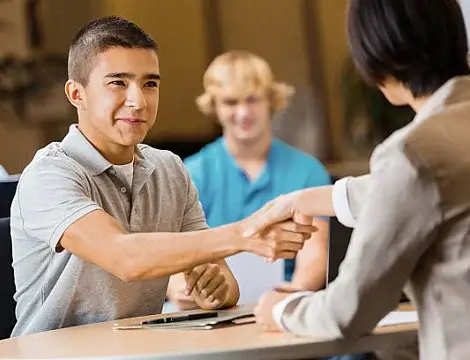 Boy shaking hand