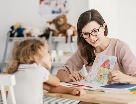 Mom helping her daughter with homework
